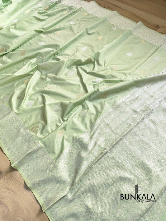 Pastel English Pista Green Double Tana Gold and Silver Zari Allover Small Buti Handloom Pure Katan Silk Banarasi Saree with Silver Zari Border