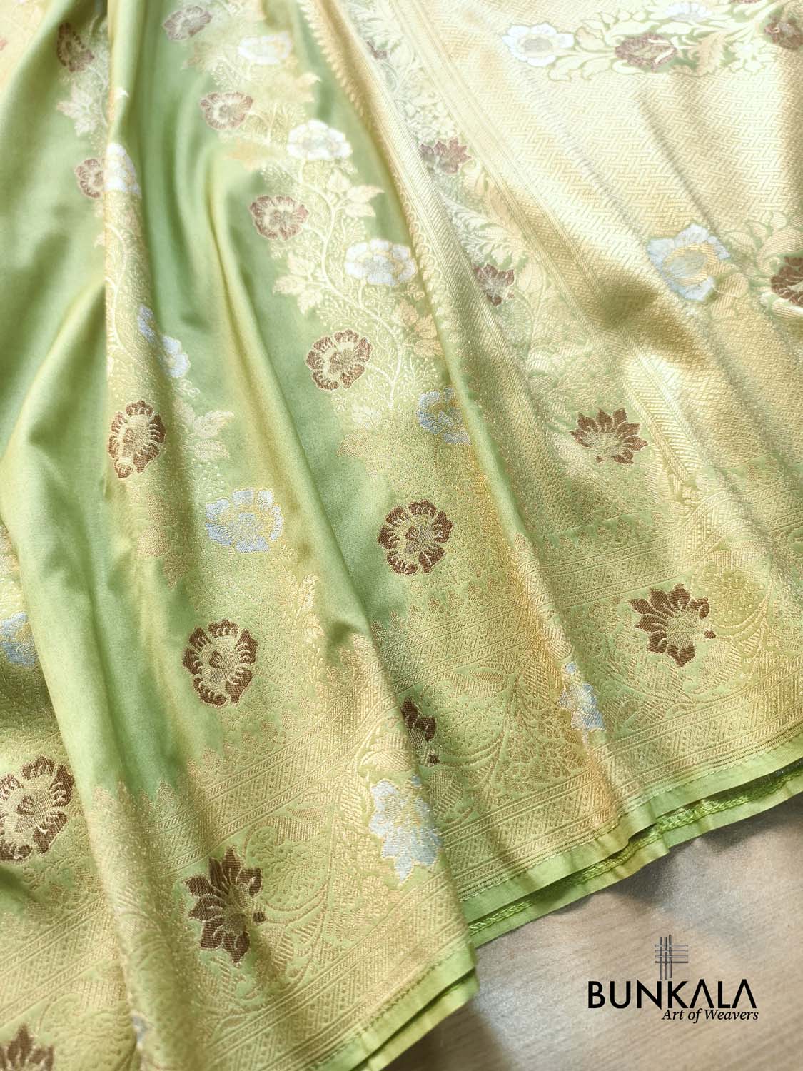 Pista Green Floral Meenakari Stripe Weaved Banarasi Silk Saree