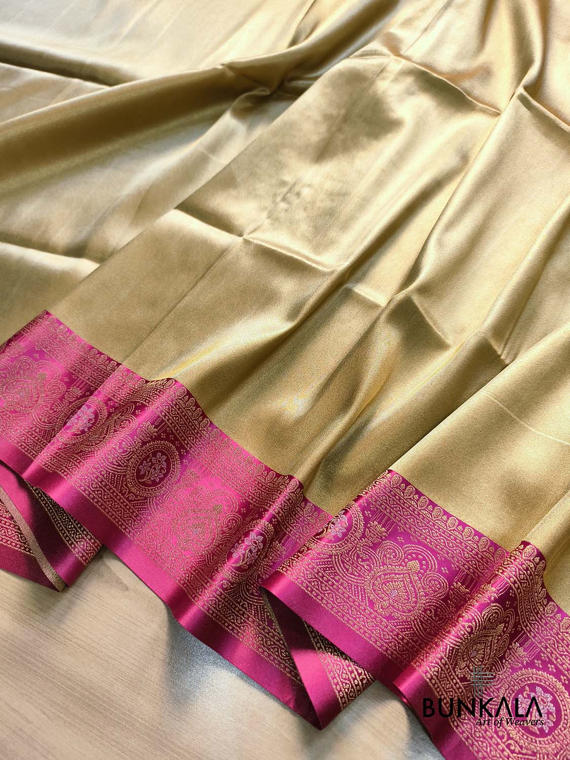Golden & Pink Plain Contrast Border Weaved Banarasi Tissue Silk Saree