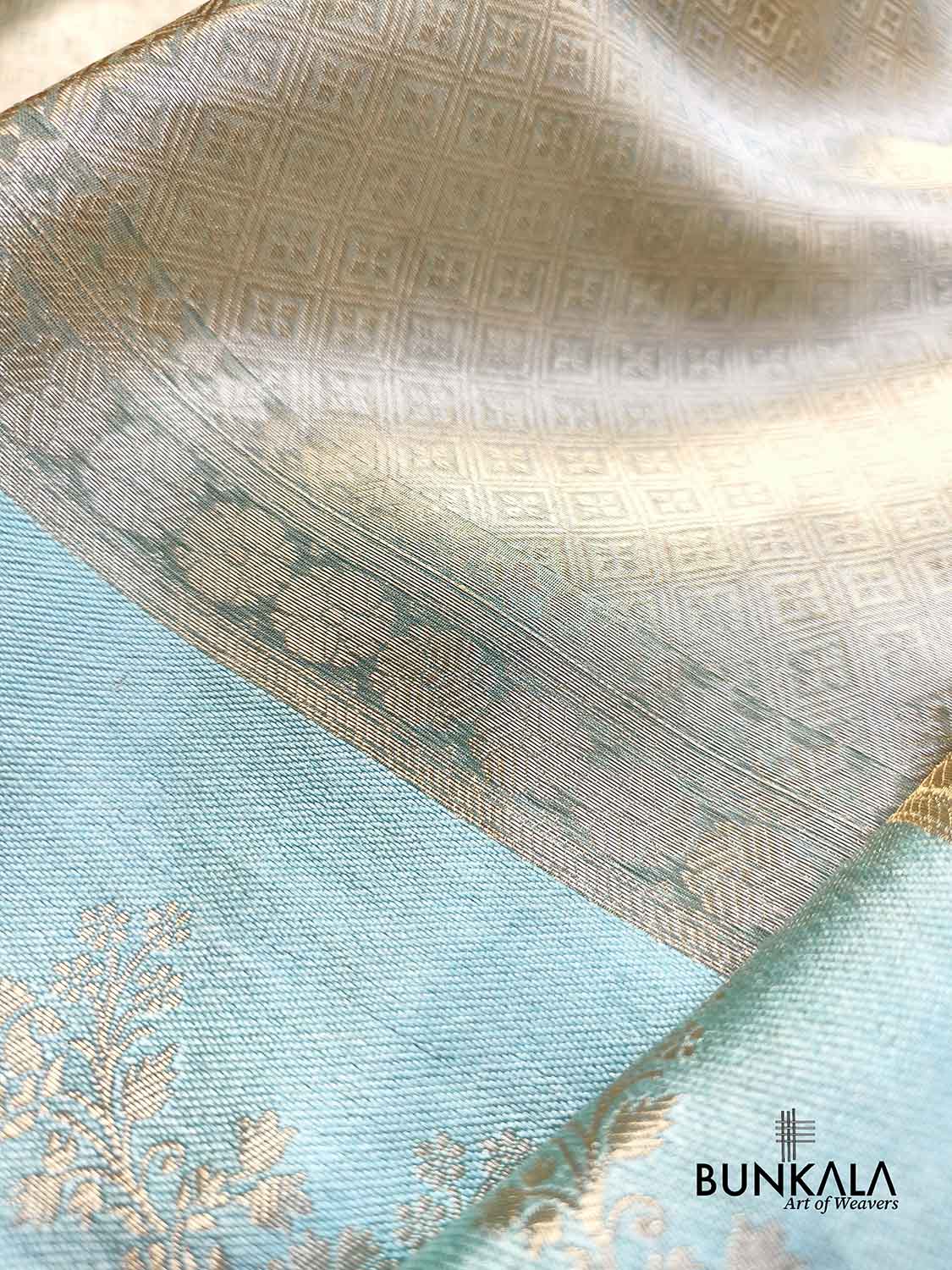 Golden Brocade Handloom Banarasi Pure Tissue Saree with Contrast Bright Sky Blue Katan Silk Floral Border