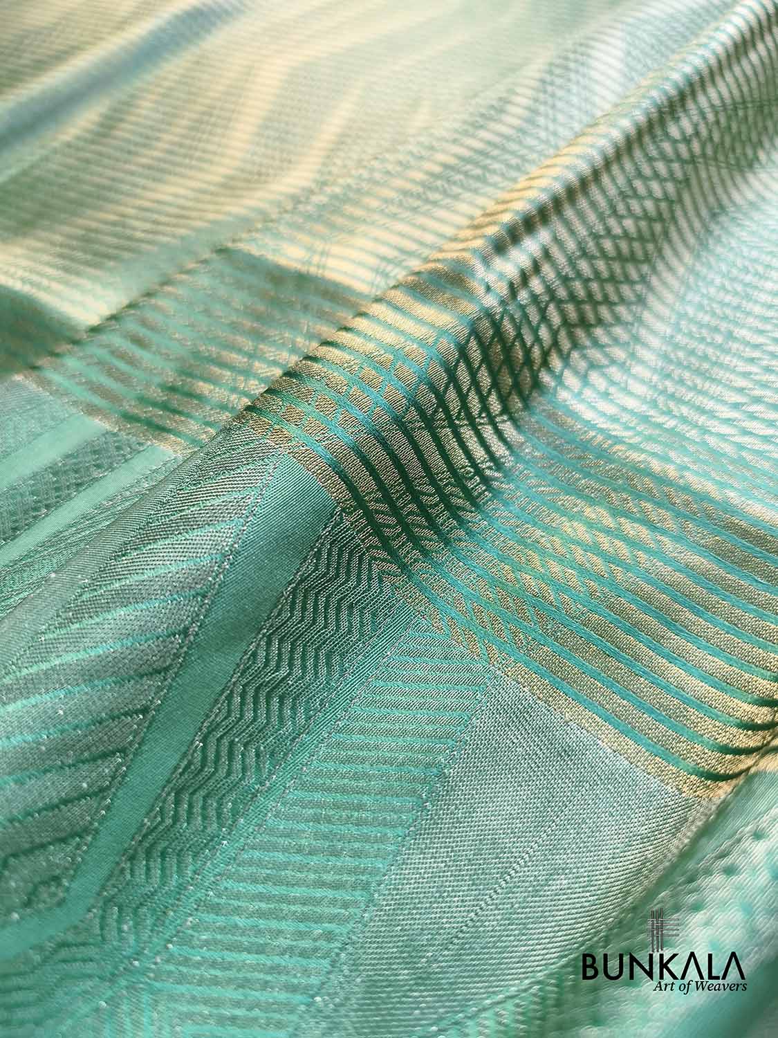 Sea Green Geometrical Zig Zag Pattern Weaved Banarasi Mashru Silk Saree
