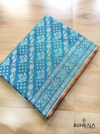 Turquoise blue Ektara Banarasi Jamdani silk saree with intricate floral weaving, elegant border and matching blouse for festive occasions.